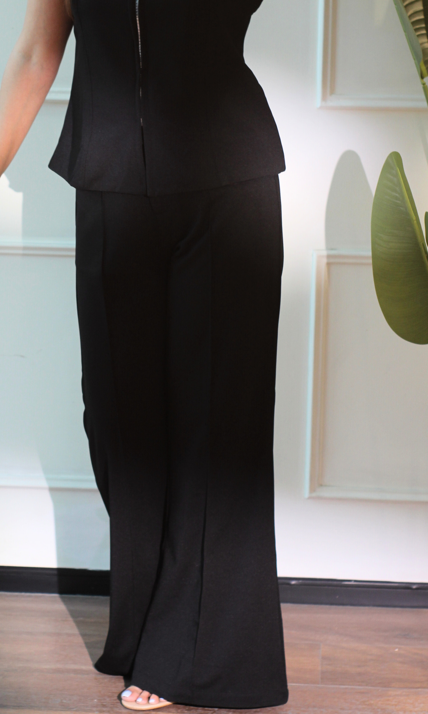 Fabric close-up of the Noir Zip Detail Top and Flared Pants Co-ord capturing the rich black tone and refined finish.
