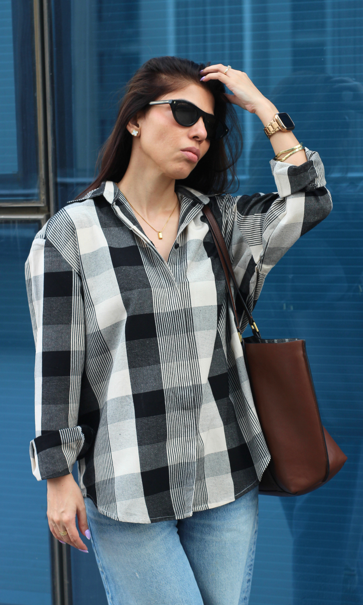 Model wearing the Monochrome Check & Striped Brushed Shirt featuring oversized checks and fine stripes in a cozy, breathable cotton fabric.