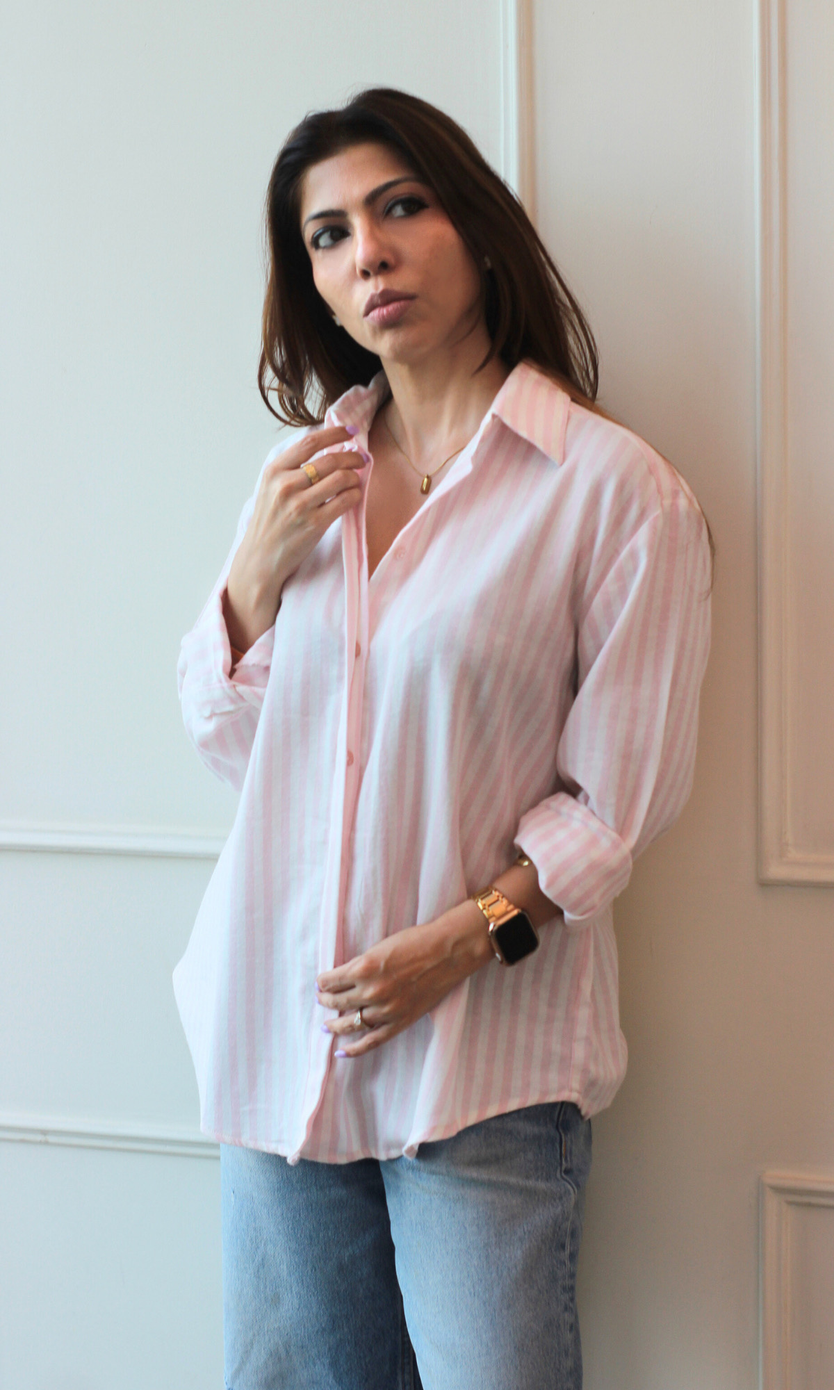 Model wearing the Rose Pinstripes Shirt featuring oversized checks and fine stripes in a cozy, breathable cotton fabric.
