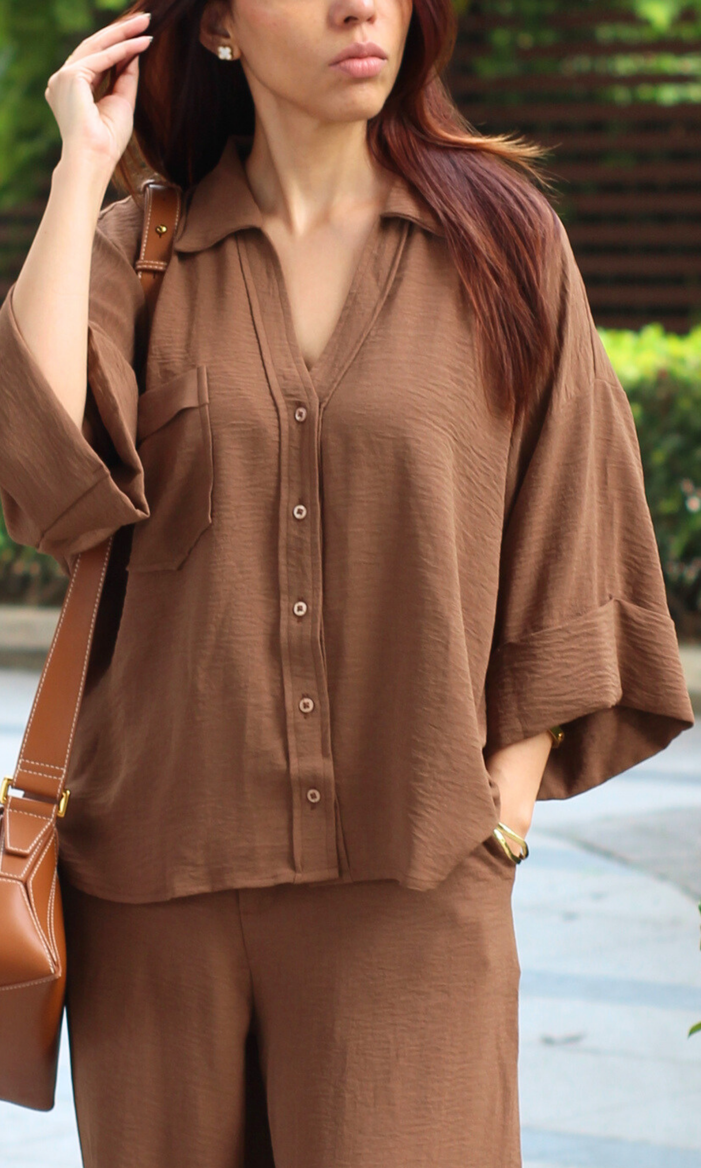 Close-up of the Soft Mocha Loose Shirt and Pants Co-ord highlighting the soft neutral fabric, button-down details, and relaxed tailoring.