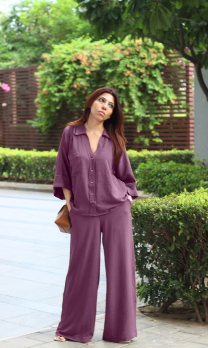 Plum co-ord set with half-sleeve shirt and wide-leg pants, styled outdoors.