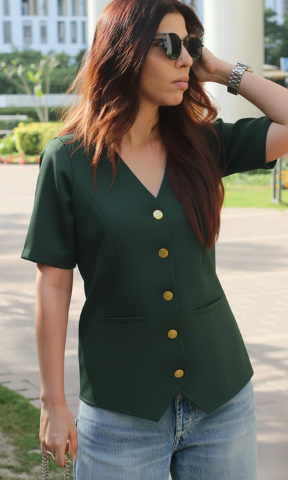 Front view of deep green waist coat featuring metallic buttons and long sleeves