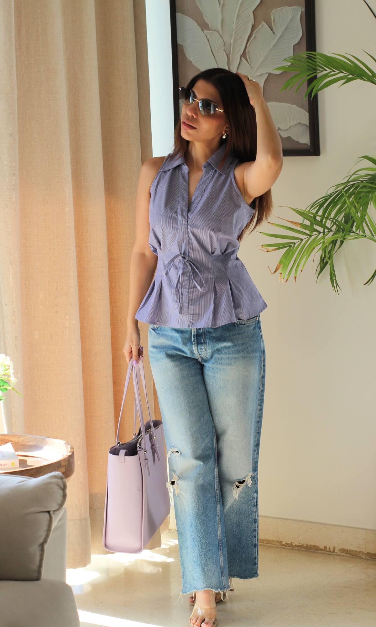 Casual chic purple stripe top featuring a waist tie detail and soft breathable fabric.