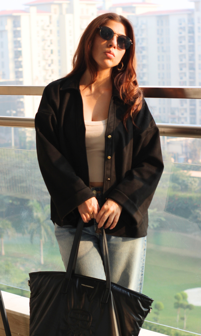 Elegant black women’s shirt in suede texture with silver-tone metallic buttons, long sleeves and a polished silhouette — ideal for modern office to nightlife.