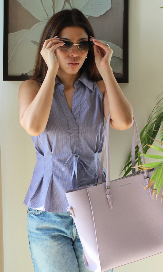 Light purple striped top with a knot/tie design at the waist, short sleeves, casual chic style.