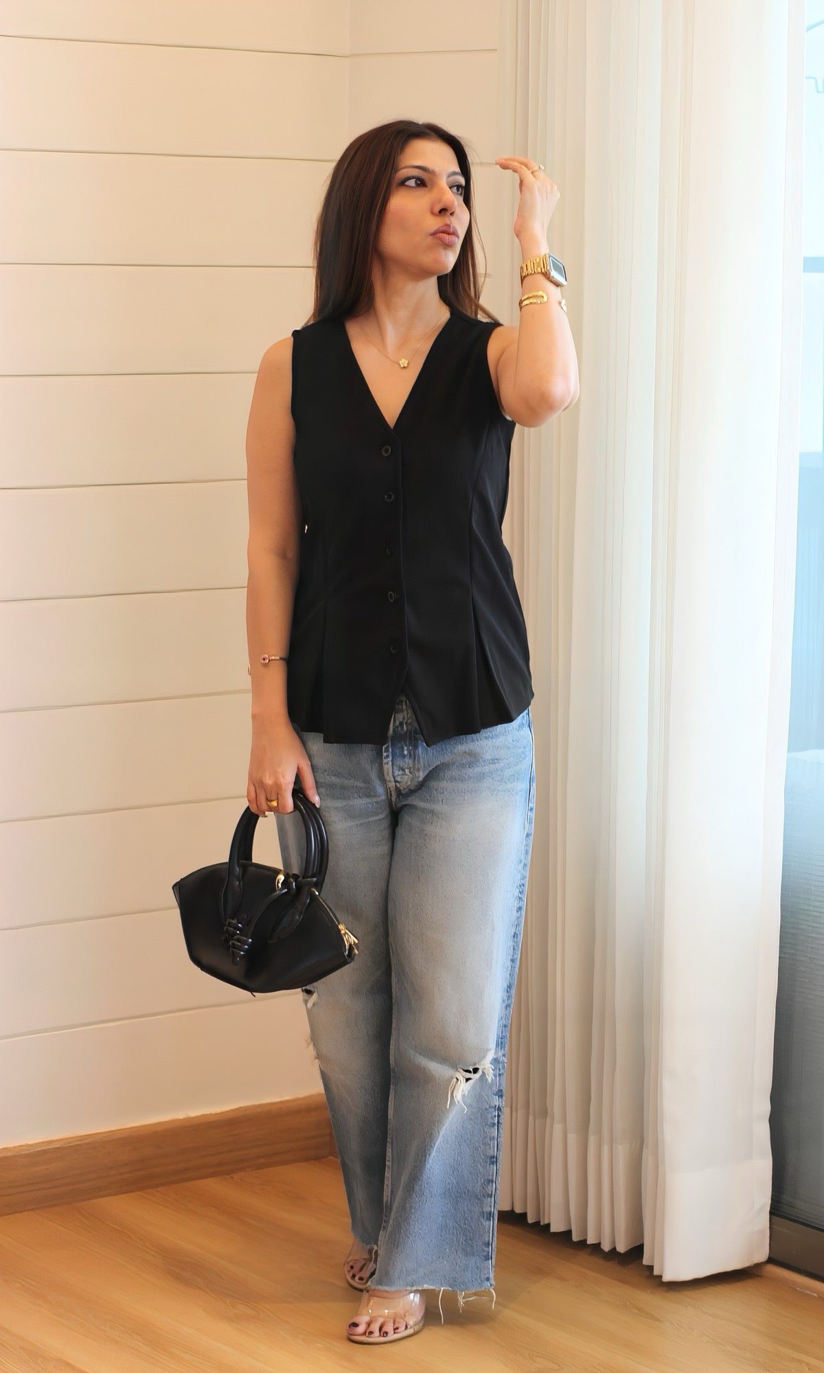 Black V-neck waist-coat in poly-cotton blend, featuring button-front closure and subtle slit detailing — ideal for smart-casual styling.