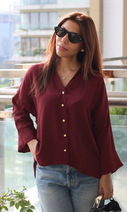 Long-sleeve brown women’s shirt with subtle metallic button accents, relaxed fit and breathable cotton fabric — ideal for transitional seasons.