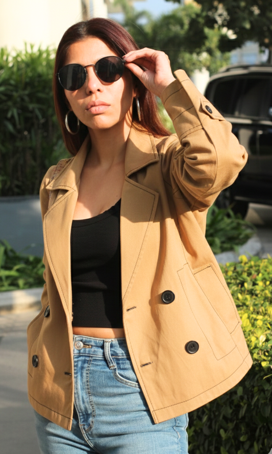 Women’s tan thread detail trench coat showcasing tailored fit and elegant stitching