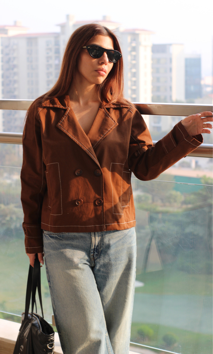 Elegant brown trench coat for women, mid-length with detailed stitching