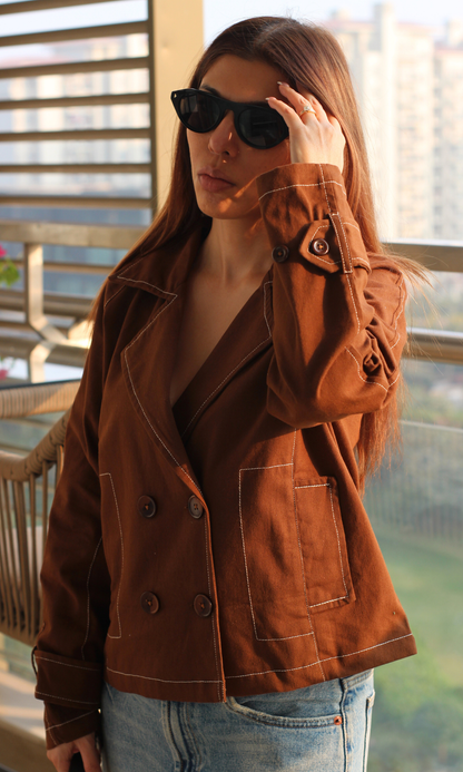 Stylish brown trench coat featuring thread-detail seams and long sleeves