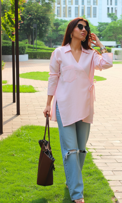Lightweight blush pink linen kimono top with cut details and a tie-front, perfect for casual and semi-formal wear.