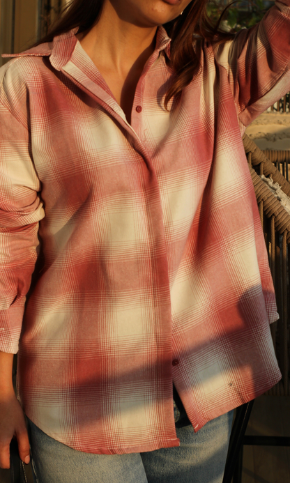 Close-up of pink ivory plaid check fabric on women’s shirt