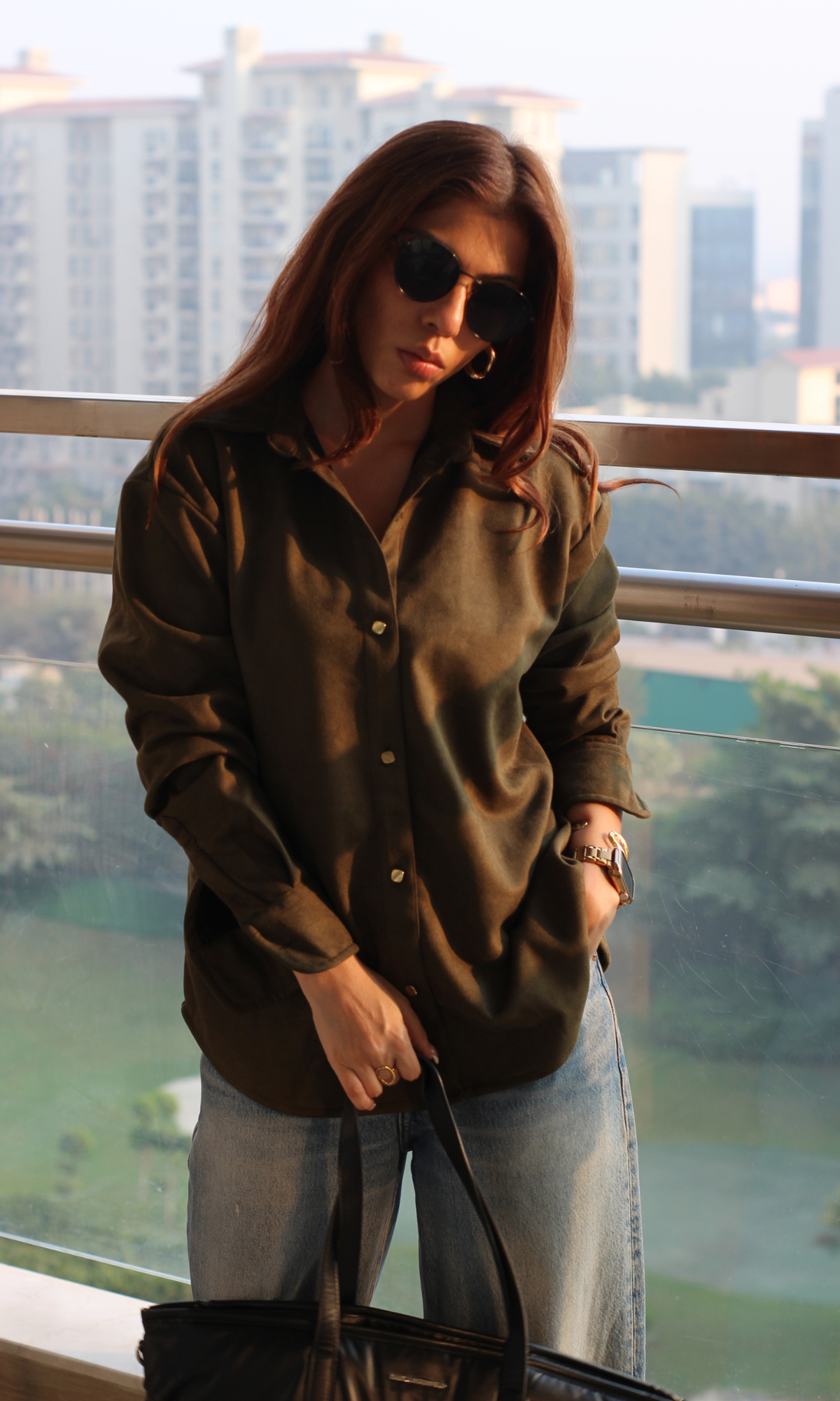 Rich pickle green suede-effect shirt with metallic buttons, long sleeves and tailored collar — a polished statement piece for womenswear.