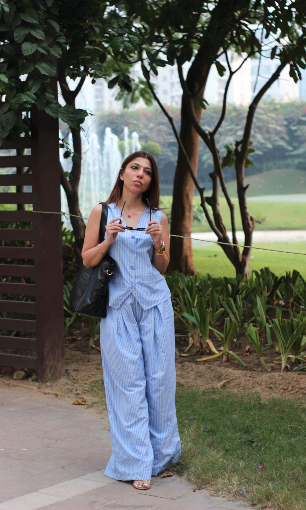 Elegant blue pinstripe waistcoat and flowy trousers outfit for women