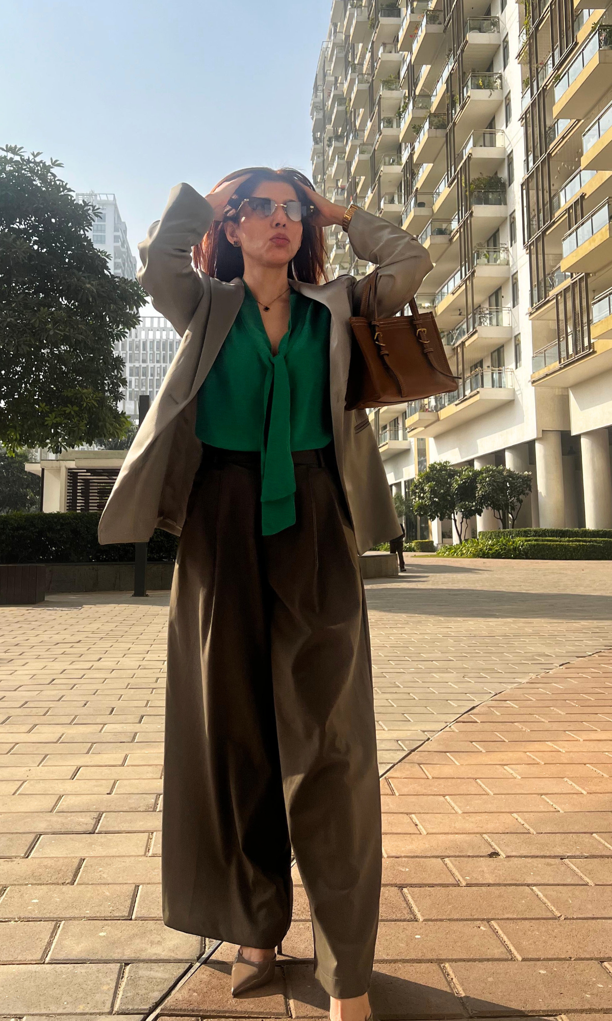 Women’s green top with adjustable tie detail and lightweight fabric