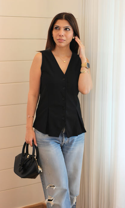 Women’s black waistcoat with button detailing, tailored design, and refined finish — a versatile wardrobe essential for formal or casual looks.