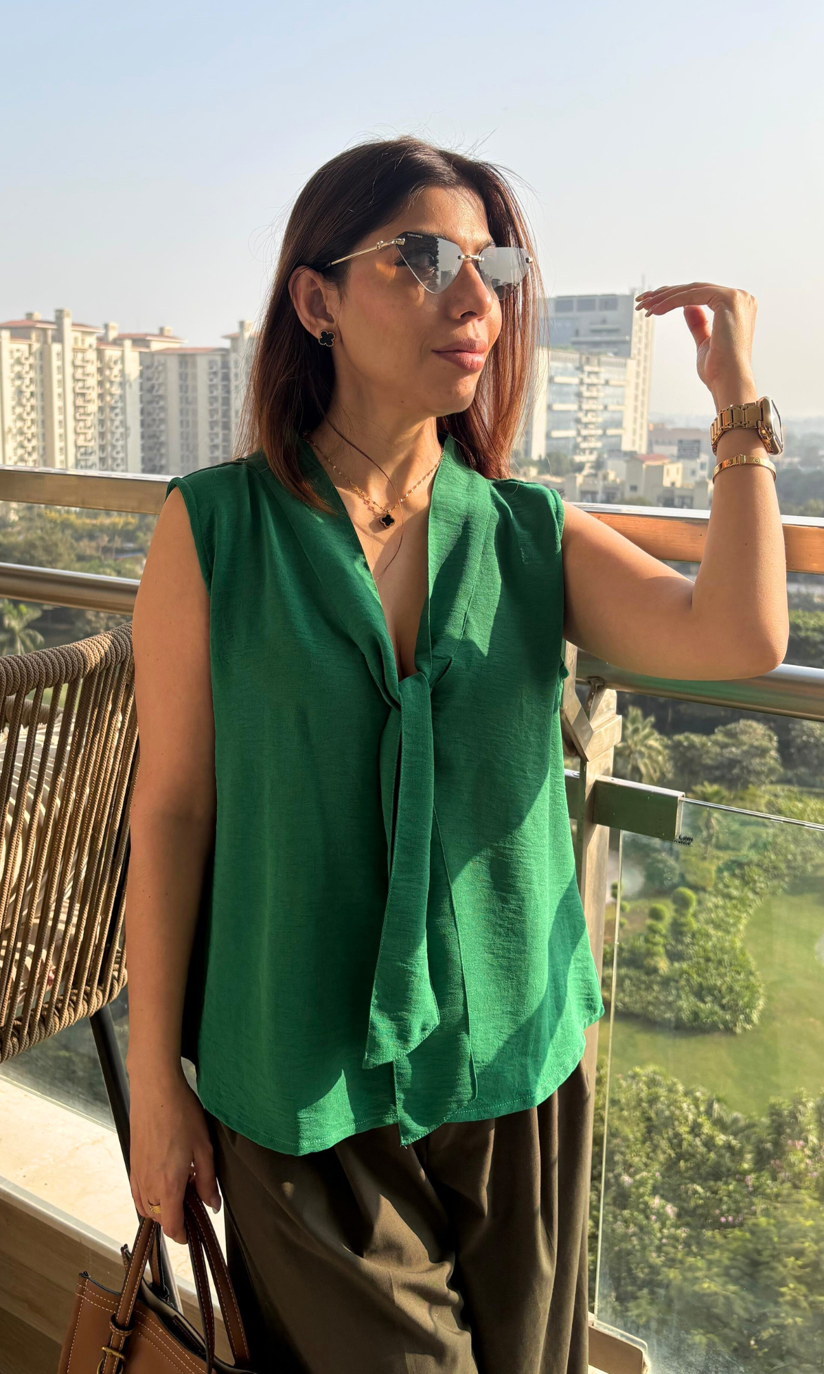 Women’s green tie detail blouse featuring soft fabric and stylish tie strings