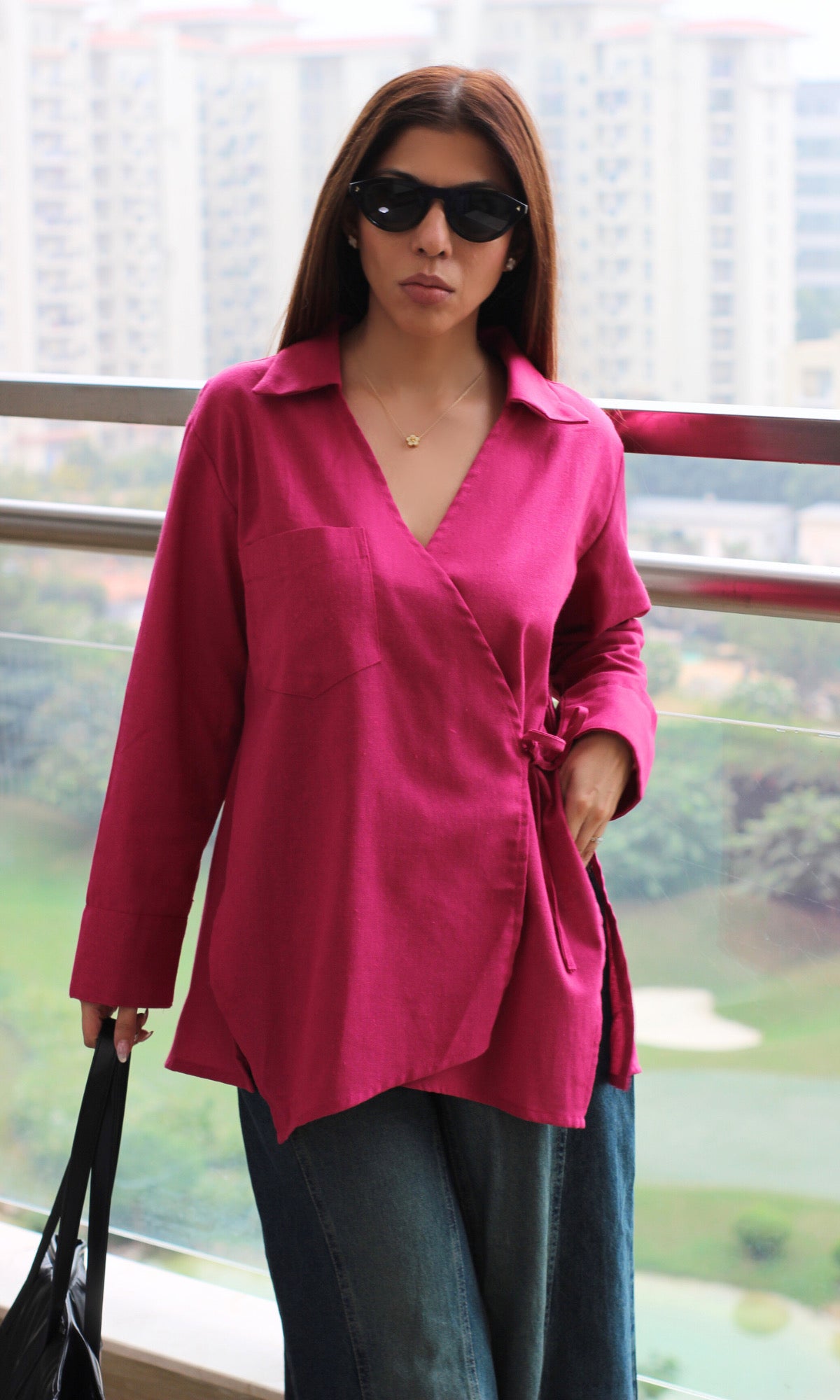 Pastel pink linen kimono top with structured wrap front, cut-detail accents and easy go-to layering style.