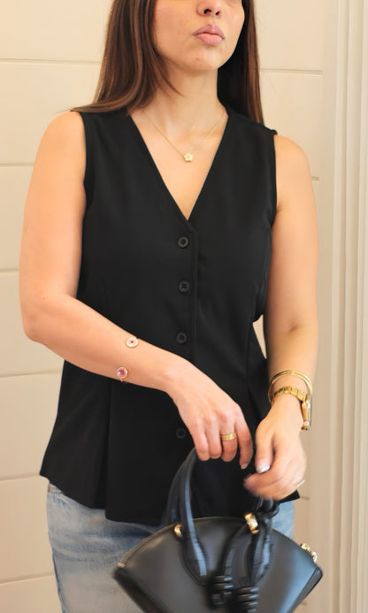Black buttoned waist coat for women featuring a sleek sleeveless silhouette, structured fit, and front button closure — perfect for layering.
