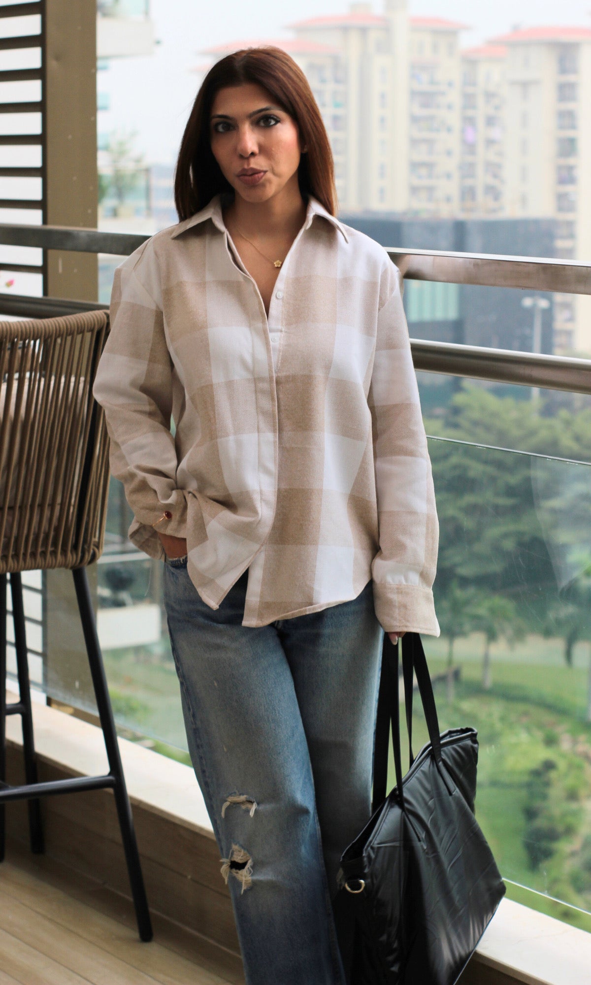 Women’s checked shirt in soft beige and ivory tones, relaxed fit and subtle pattern — a versatile layering piece.