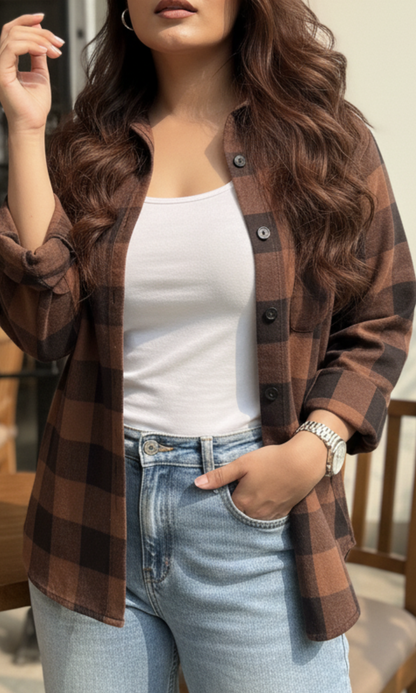 Close-up of woman wearing a brown and black block plaid checked shirt styled over a white tank top