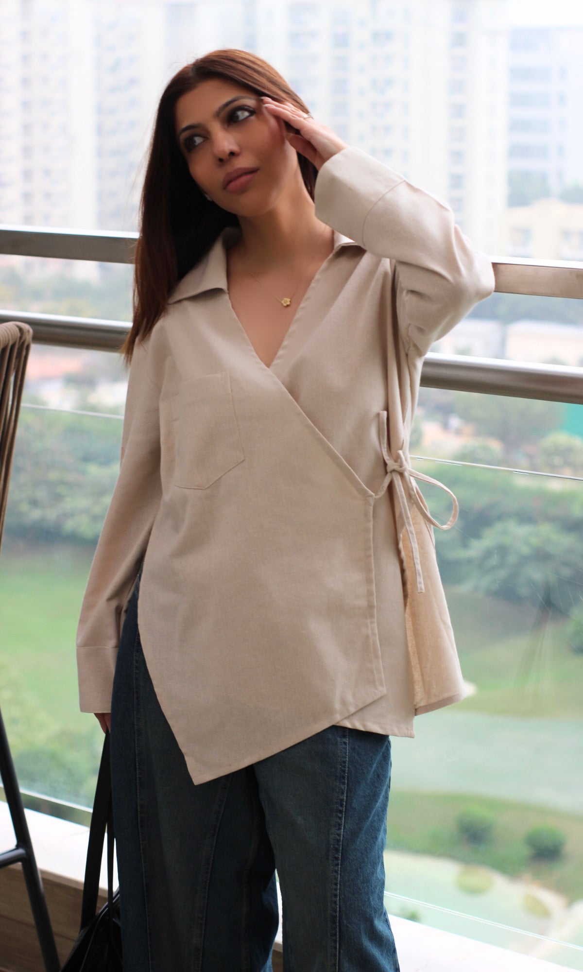 Beige linen-blend kimono top with cut-detail design, wrap‐style silhouette and tie closure.
