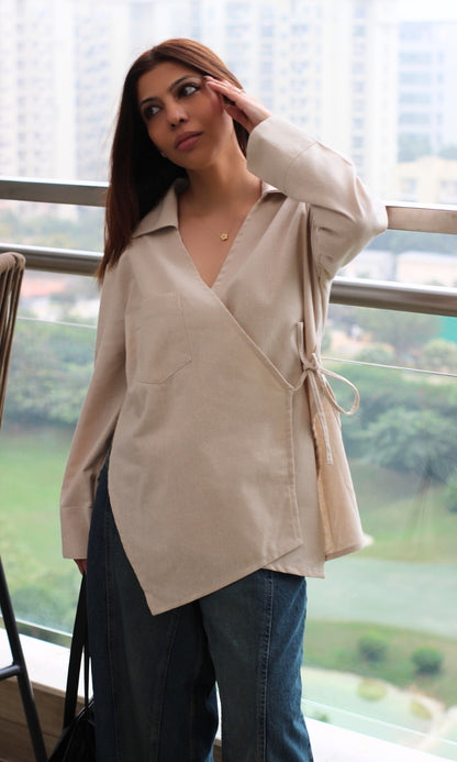 Beige linen-blend kimono top with cut-detail design, wrap‐style silhouette and tie closure.