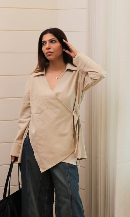 Neutral beige kimono top featuring linen texture, cut detail accents and a wrap tie at the waist.